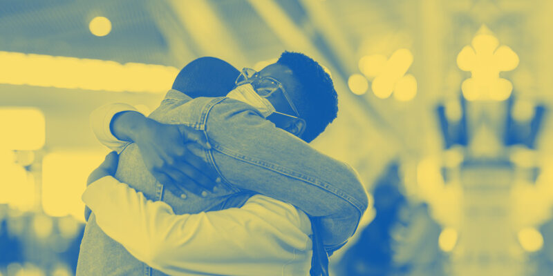 A treated image of two individuals embracing.